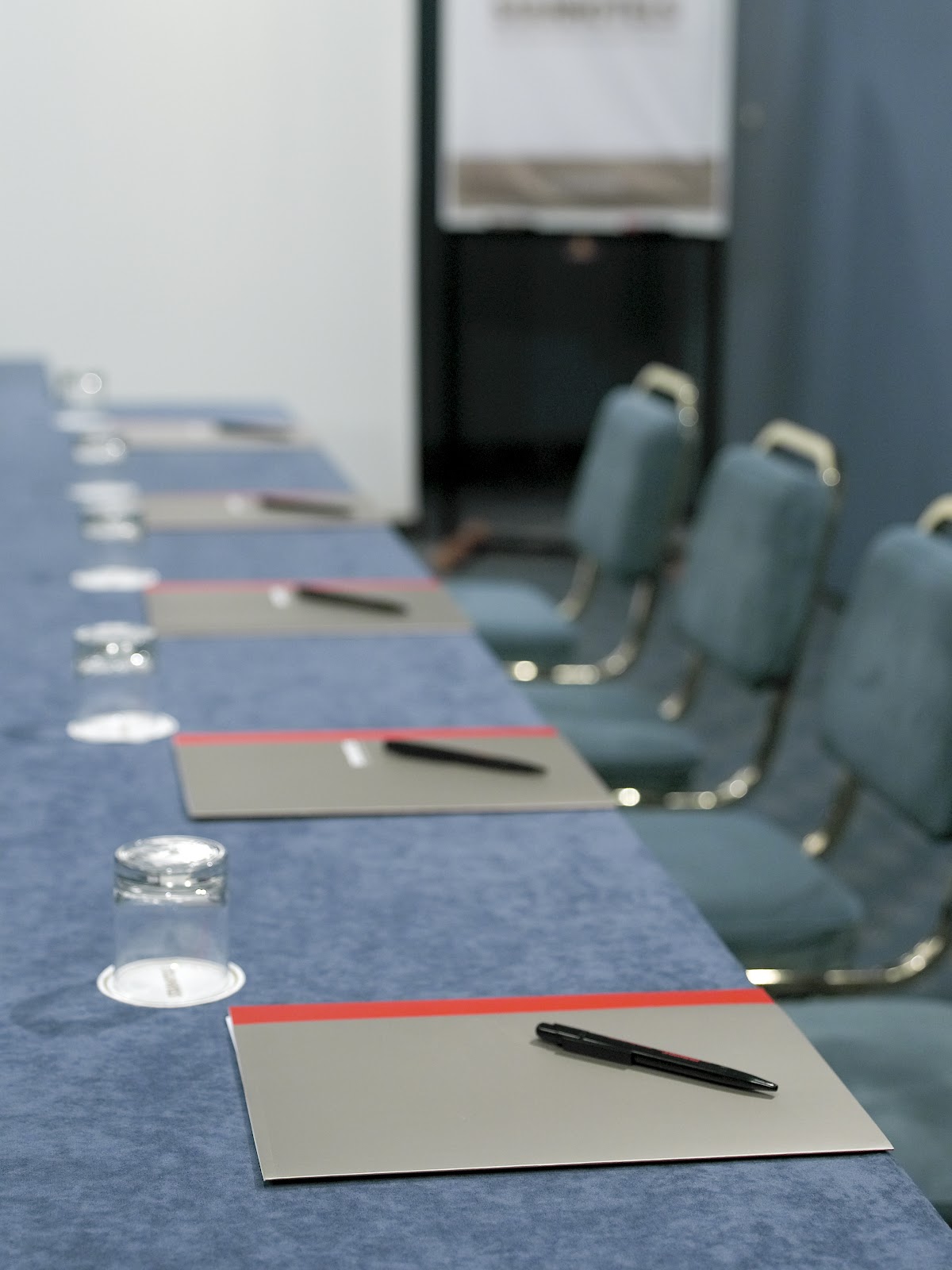 Boardroom table set for board of directors meeting