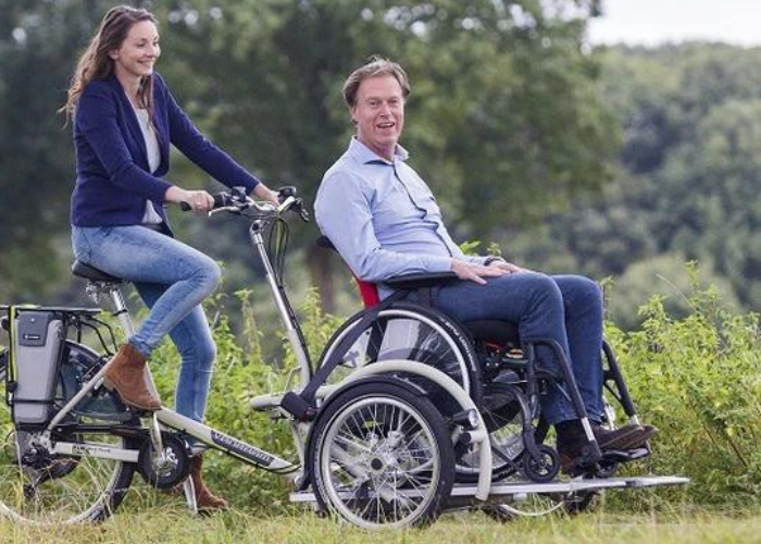 1 The VanRaam VeloPlus Wheelchair Bicycle provides a unique experience for individuals in a wheelchair. The device allows a staff member or loved one to pedal while the individual in the wheelchair can sit in the front as a passenger.